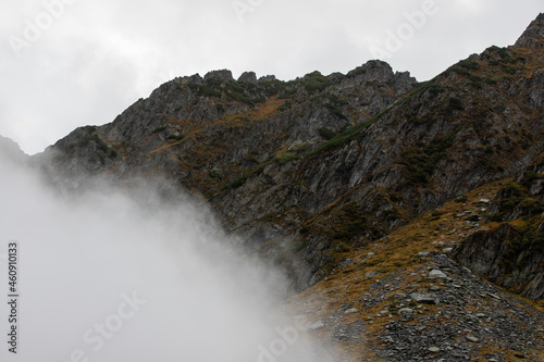 Fog clouds on a mountain slope
