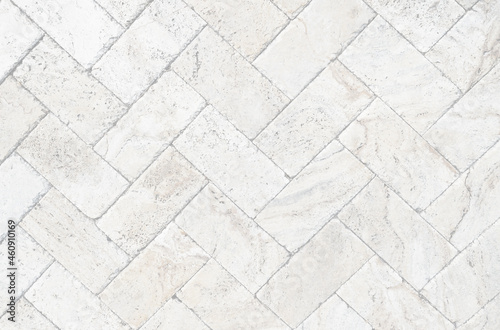 White brick pavers sidewalk background. Neutral texture of a flat brick wall close-up. 