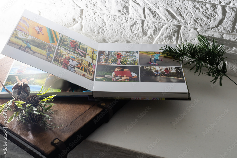 Luxury wooden photo book, wooden box with summer photos printed and flash card on linen natural background. Family memories photobook. Save your summer vacation memories. Photo album with wooden cover - obrazy, fototapety, plakaty 