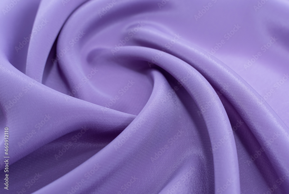 Obraz premium A piece of purple cloth. Fabric texture for background and design works of art, beautiful wrinkled pattern of silk or linen. A crumpled piece of cloth