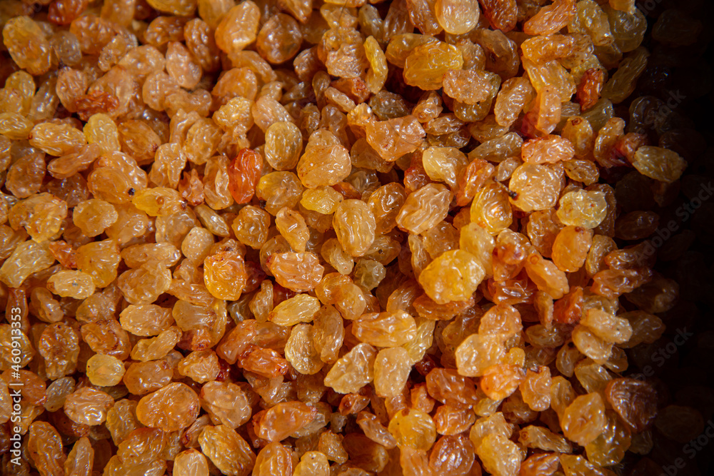 Beautiful raisins on the market counter. Dried fruits close-up. Beautiful raisins on the market counter. Dried fruits close-up.