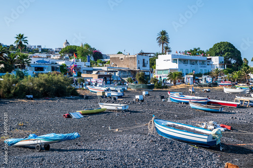 Stromboli island (Aeolian archipelago), Lipari, Messina, Sicily, Italy, 08.21.2021: view of the village with many boats on the black lava beach.