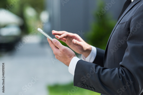 Close up of businessman using tablet browsing internet © Liubomir