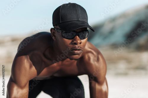 sporty African American man, young sportsman ready for morning jogging outdoors in the mountains © Shopping King Louie