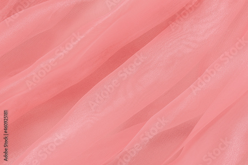 Pastel fabric background with drapery waves, tender texture. Delicate gentle material. Soft focus