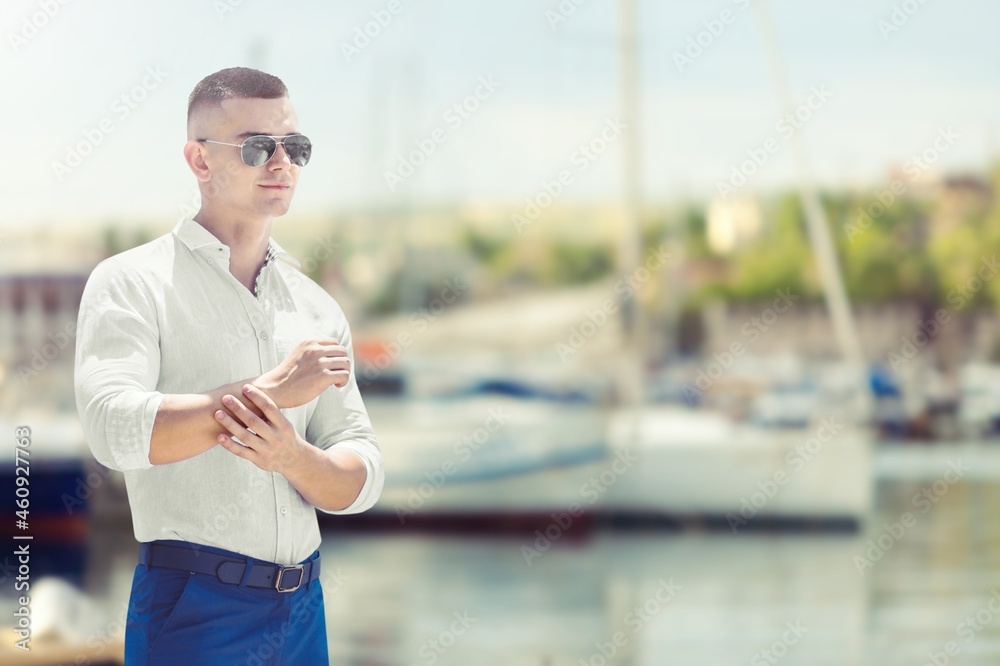 Relaxed businessman working on the yacht on a sunny day background