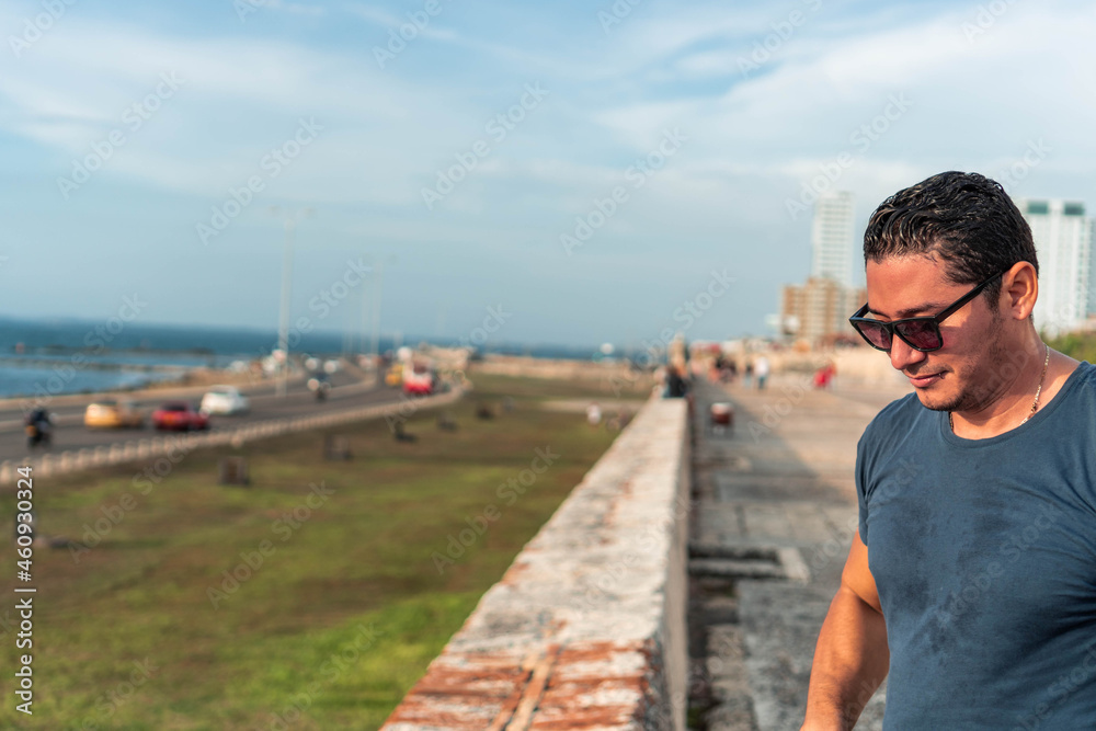Portrait of handsome latin man looking to the side. Lifestyle concept