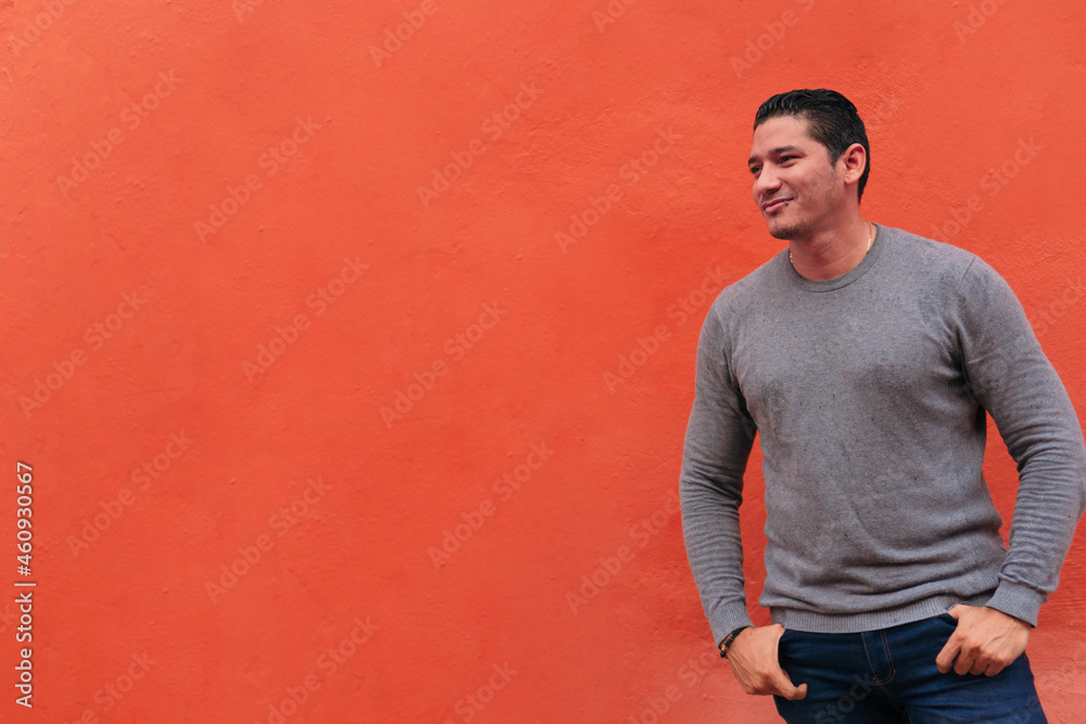 Portrait of a handsome Latino hipster walking down the street. Lifestyle concept Portrait of a handsome Latino hipster walking down the street. Lifestyle concept