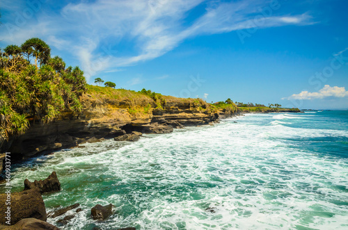 Beautiful Uluwatu coast with rocks and ocean waves, Bali, Indonesia