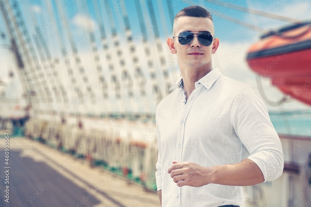 Relaxed businessman working on the yacht on a sunny day background Relaxed businessman working on the yacht on a sunny day background