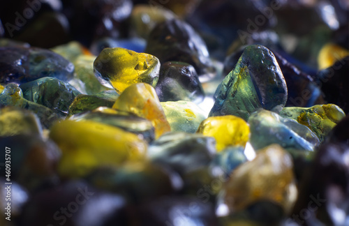 A cluster of rough particolored Sapphire gemstones