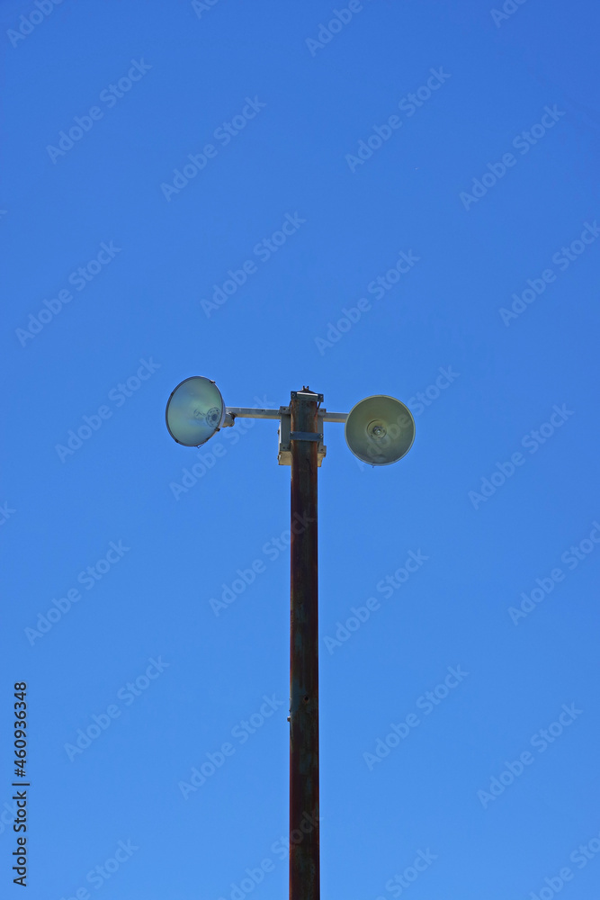 Lighting equipment and floodlights on a high mast at an outdoor sports field Lighting equipment and floodlights on a high mast at an outdoor sports field