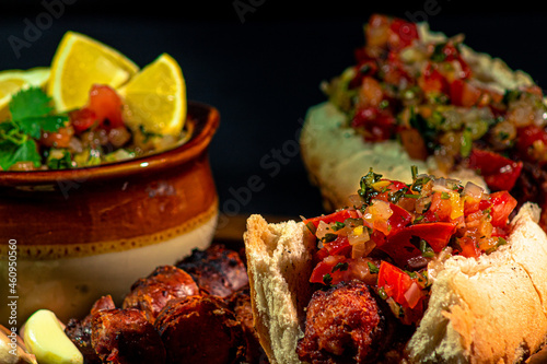 detail of a choripan with pebre in a traditional Chilean barbecue for national holidays