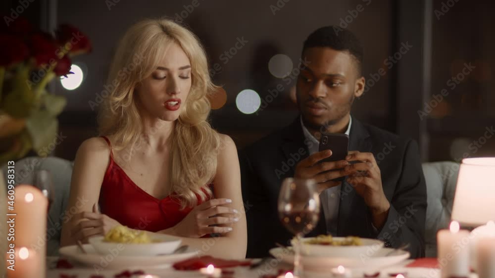 Cheating Husband Texting On Phone During Dinner With Wife Indoor Cheating Husband Texting On Phone During Dinner With Wife Indoor