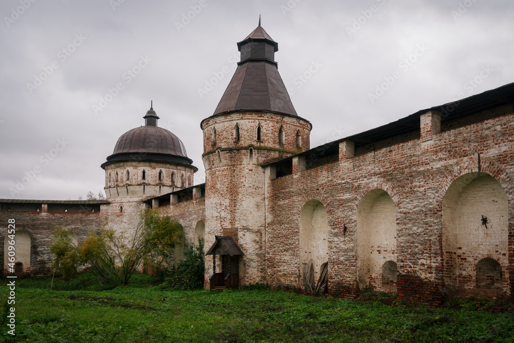 View of the wall and towers of the male Orthodox Borisoglebsky Rostov Monastery in the village of Borisoglebsky on an autumn day, Rostov the Great, Yaroslavl region, Russia