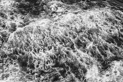 Black and white ocean waves top view texture. Abstract art nature photography for interior decor. Beach coastal decoration.