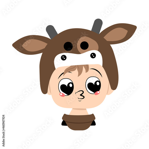 Boy with big heart eyes and kiss lips in a cow hat. Head of cute child with joyful face in carnival costume for holiday  Christmas or New year