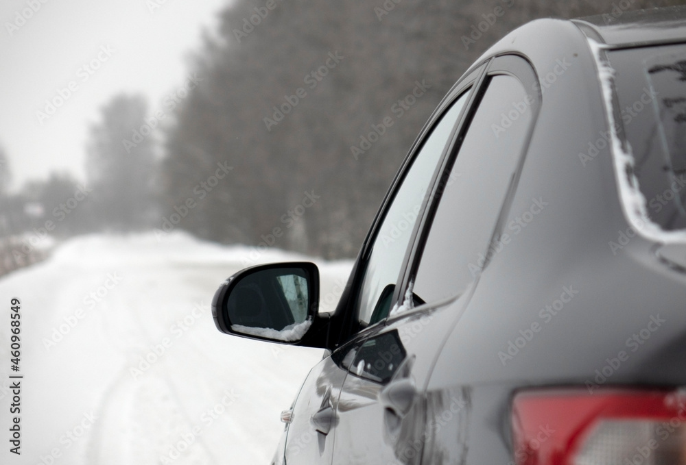 A car on a winter road. The concept of safe driving.