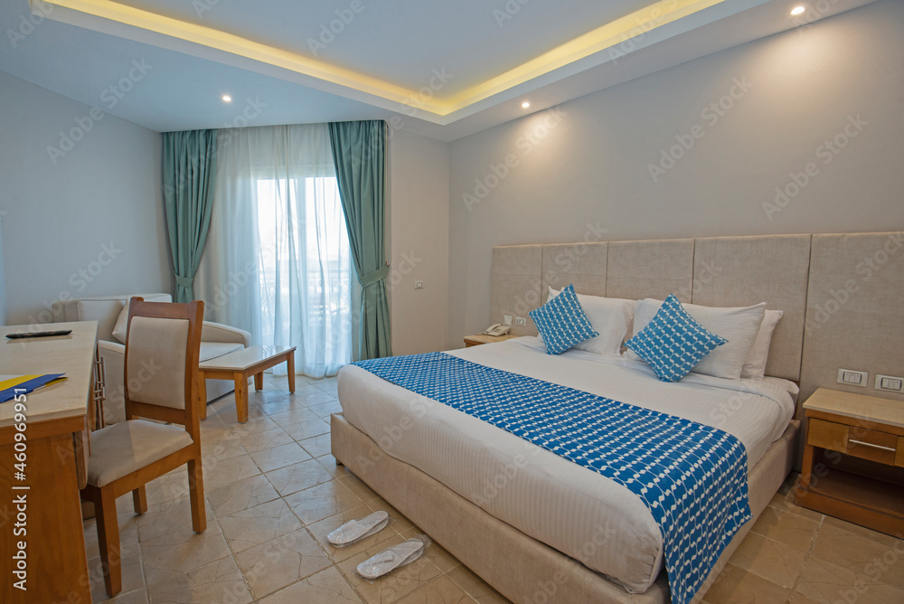 Fototapeta premium Double bed in suite of a luxury hotel room