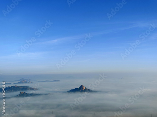 Distant view of Shivagange hills above the clouds, Karnataka, India © RealityImages