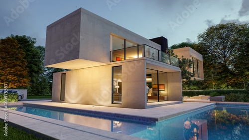 Big contemporary villa with garden and swimming pool in the evening