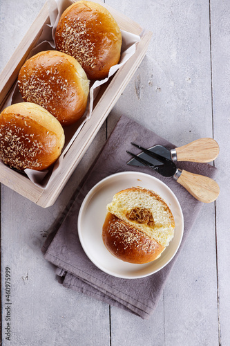 Roti isi unti kelapa or coconut buns with shredded coconut Javanese sugar filling. photo