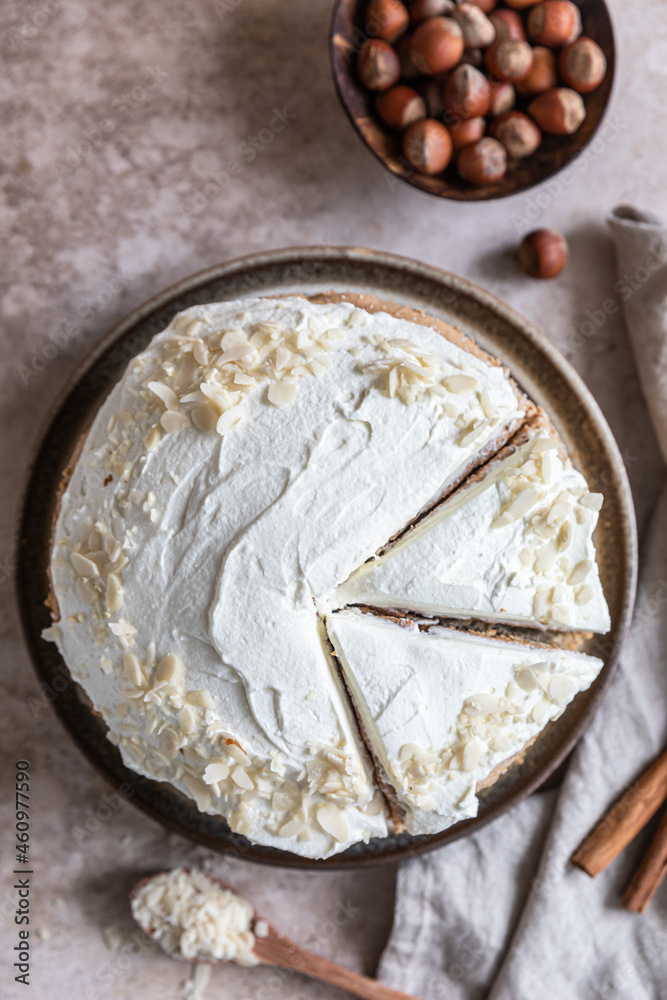 Homemade sponge cake or biscuit with nuts and spices decorated with butter cream or cream cheese icing. Homemade sponge cake or biscuit with nuts and spices decorated with butter cream or cream cheese icing.