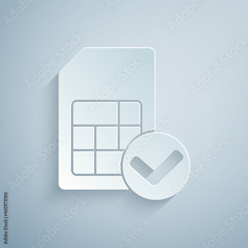 Paper cut Sim card icon isolated on grey background. Mobile cellular phone sim card chip. Mobile telecommunications technology symbol. Paper art style. Vector