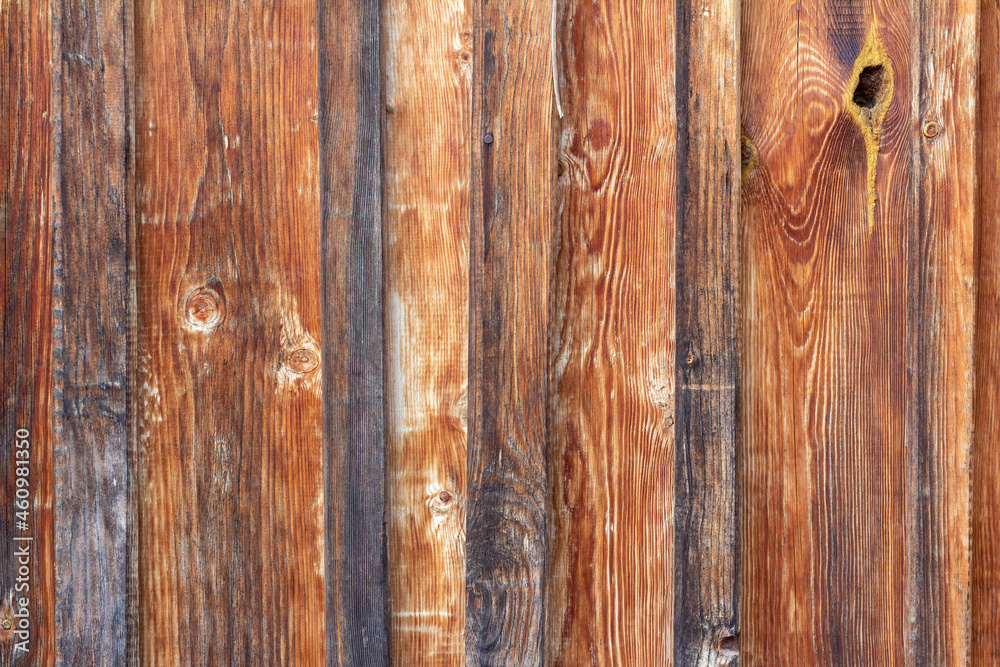 Naklejka premium Wooden background.The texture of natural wooden boards, darkened by time.