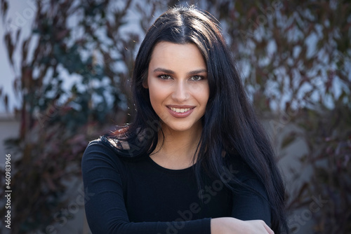 Portrait of a mediterranean and middle eastern mixed race woman with long, black hair photo