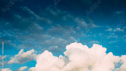 Huge white fluffys clouds sky background with blue sky background
 photo