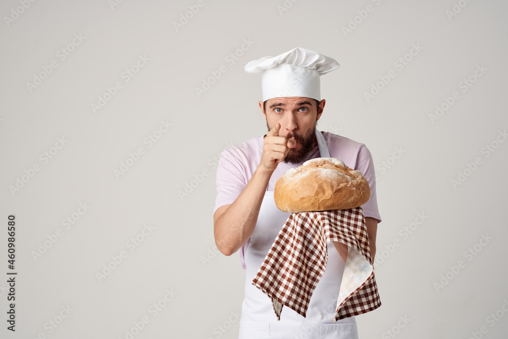 a man in a chef's uniform fresh bread cooking baking a man in a chef's uniform fresh bread cooking baking