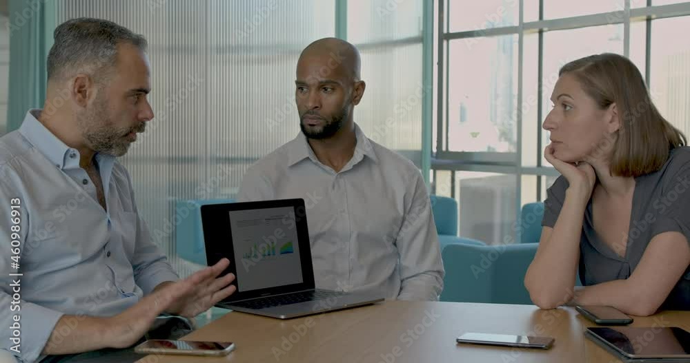 African American businessman leading a corporate meeting African American businessman leading a corporate meeting
