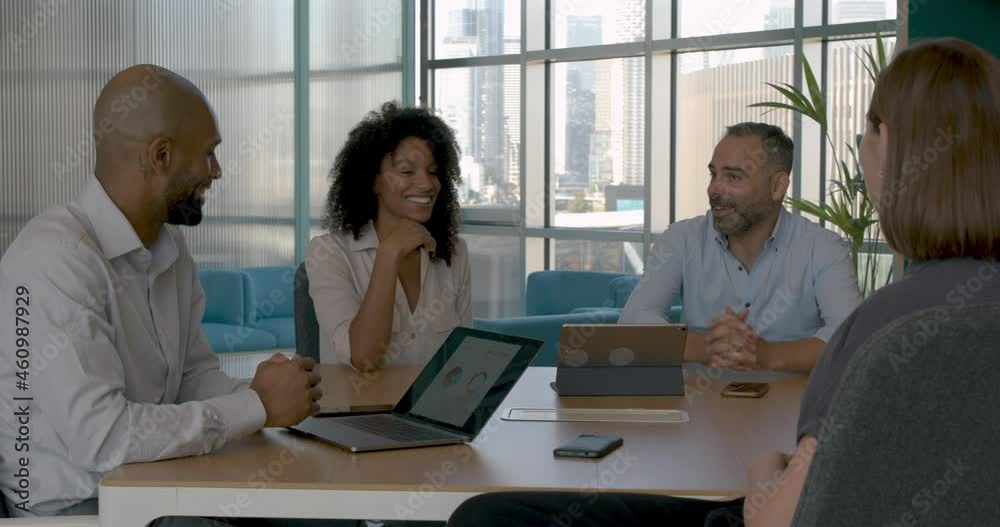 Business executives shaking hands in a business meeting Business executives shaking hands in a business meeting