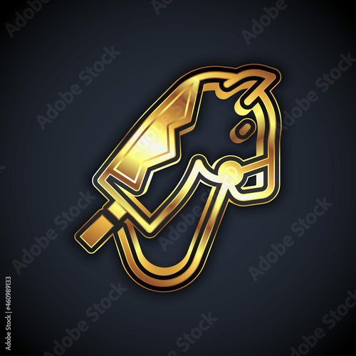 Gold Toy horse icon isolated on black background. Vector