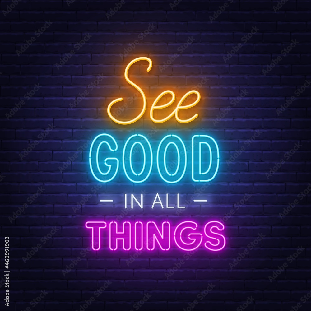 See Good in all Things neon lettering on brick wall background.