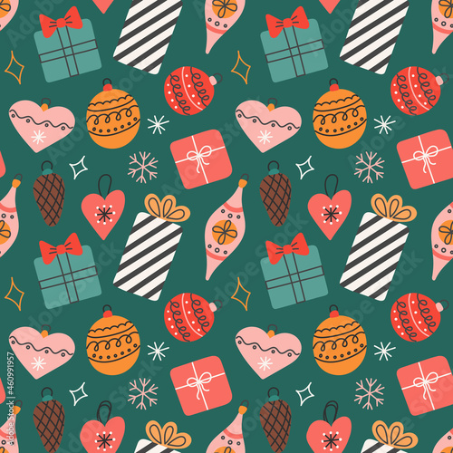 Gifts and Christmas tree toys with snowflakes on green background, vector seamless pattern in flat style