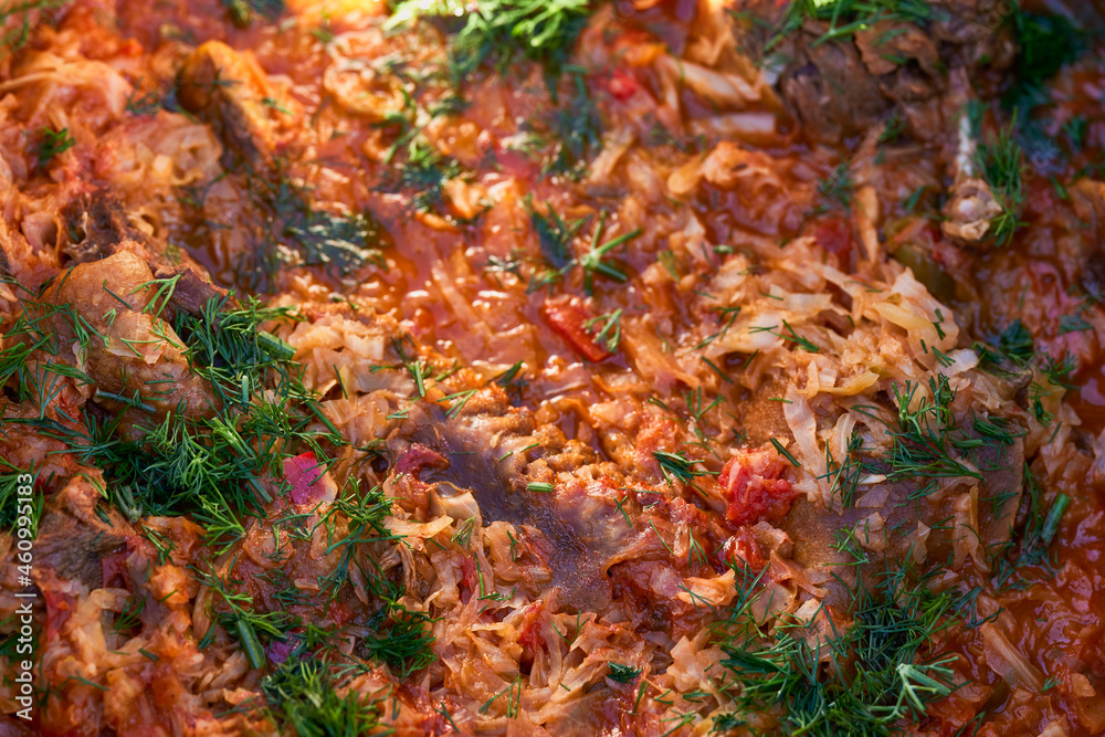 Spicy stewed cabbage and meat with beef and sauerkraut Bigos is traditional  food.