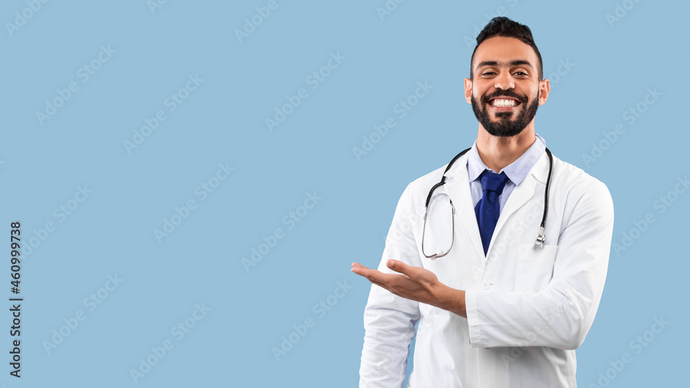 Happy Arabic Doctor Man Smiling Showing Copy Space, Blue Background Happy Arabic Doctor Man Smiling Showing Copy Space, Blue Background