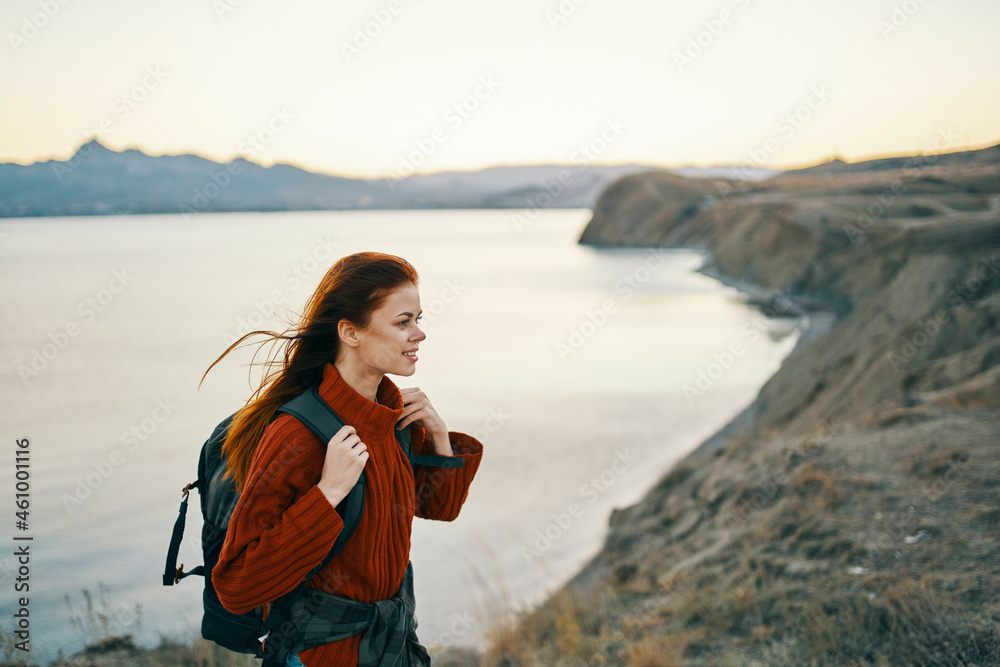 woman hiker with backpack on her back walking mountain landscape woman hiker with backpack on her back walking mountain landscape