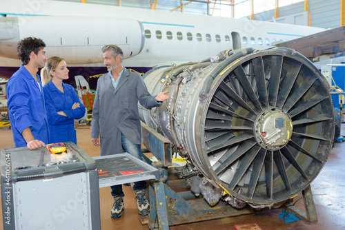 engineers in aircraft maintenance factory