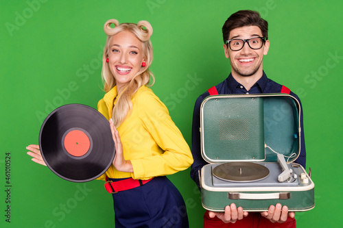 Photo of young couple music retro player acoustic event holiday isolated over green color background