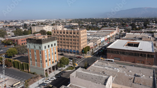 During a break in the fog, afternoon sunlight shines on the historic city center of downtown Salinas, California, USA. photo
