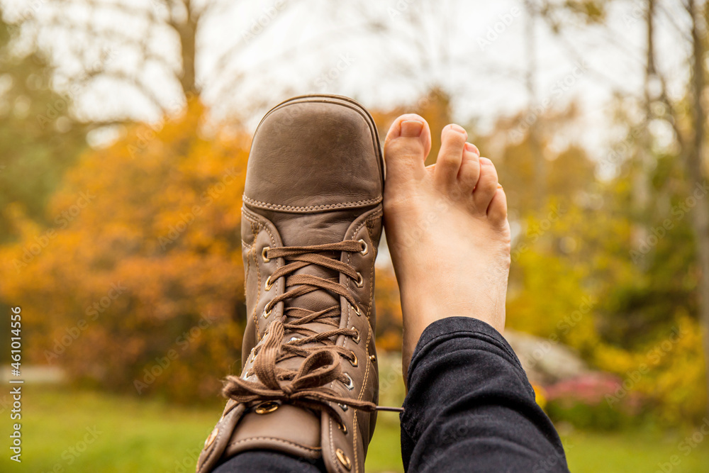 Person wearing barefoot boots shoes, which are wide, comfortable and