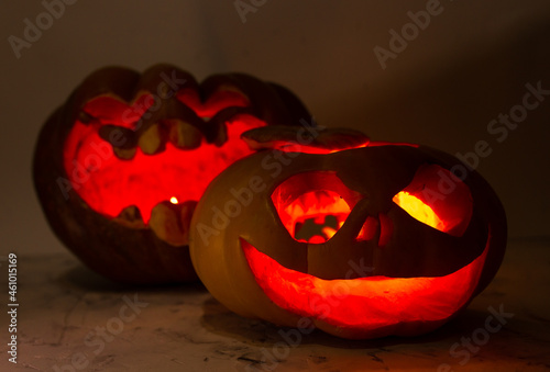 festive pumpkins with carved faces for halloween