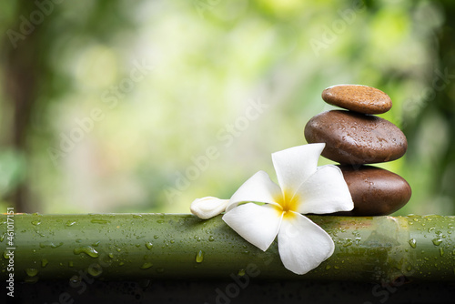 Canvas Print Relaxation with frangipani flower on bokeh nature surface.