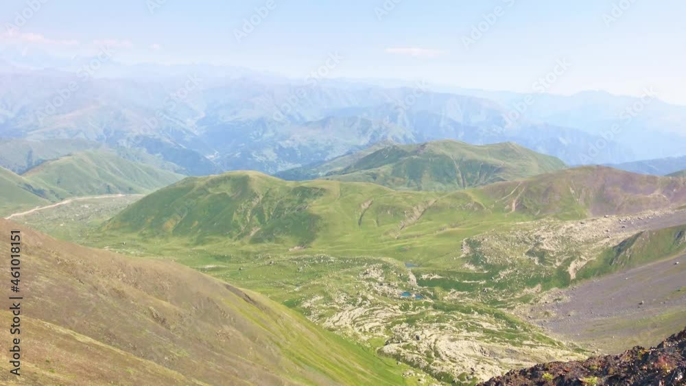 Chaukhi massif pass 3340 m altitude panoramic views in KAzbegi national park. Hikers enjoy panorama outdoors in Kazbegi. Chaukhi massif pass 3340 m altitude panoramic views in KAzbegi national park. Hikers enjoy panorama outdoors in Kazbegi.