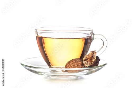 Black cardamom and tea isolated on white background.