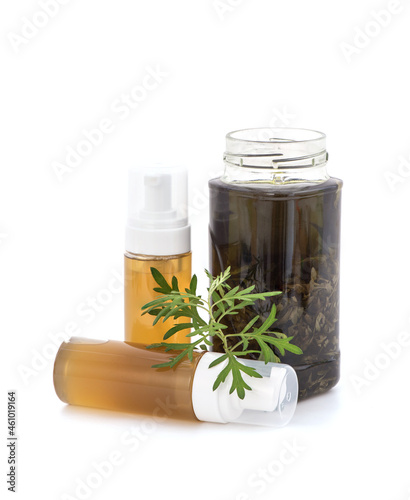 Shampoo or liquid soap with mugwort extract isolated on white background. photo