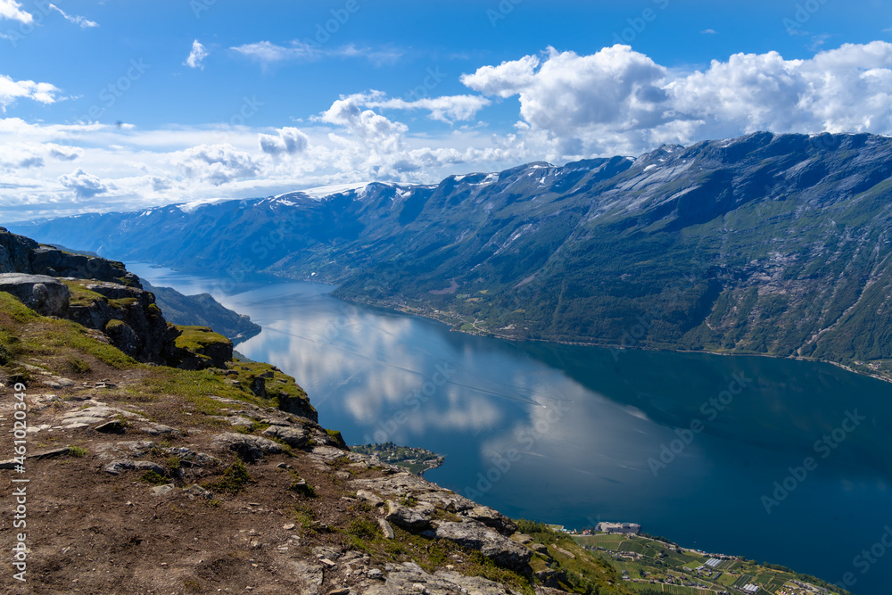 Hiking the famous Dronningstien (the Queen’s route). Stunning view of the Sørfjord, Hardangerfjord and Folgefonna glacier from the Hardangervidda plateau, Hardanger, Norway. Hiking the famous Dronningstien (the Queen’s route). Stunning view of the Sørfjord, Hardangerfjord and Folgefonna glacier from the Hardangervidda plateau, Hardanger, Norway.